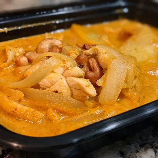 Massaman Curry with chicken. $12. Potatoes, onions, and cashews in coconut milk.