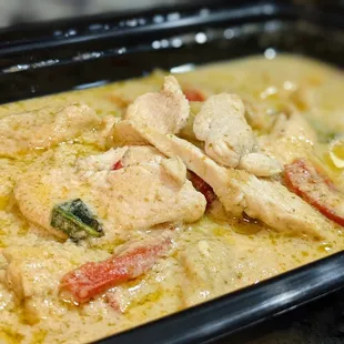 Green Curry with chicken. $12. Bamboo shoots, red bell peppers, and basil in coconut milk. Comes with steamed jasmine rice.