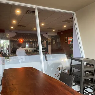 a woman sitting at a table in a restaurant