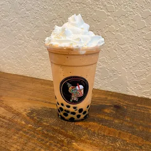 Original Thai milk tea slushy with whipped cream and boba.