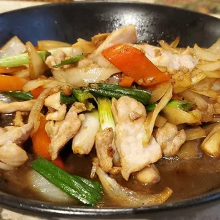a stir fry with chicken and vegetables
