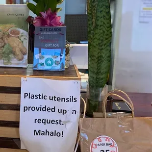 Plastic utensils provided upon request. $0.25 -brown paper bag w/handles.