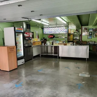 Interior - there&apos;s about four tables inside and to the right for dining-in