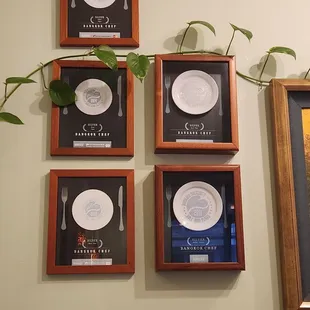 Wall of awards at the Manoa location.