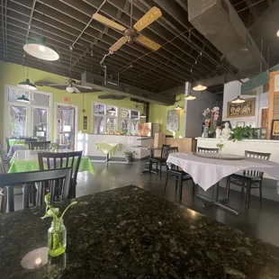 a dining room with tables and chairs
