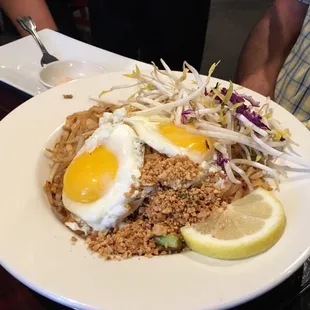 Chicken pad Thai, with requested 2 sunny side up eggs.