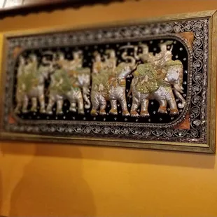 a woman looking at a painting