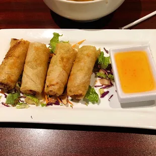 Deep fried Thai vegetable rolls with plum sauce.