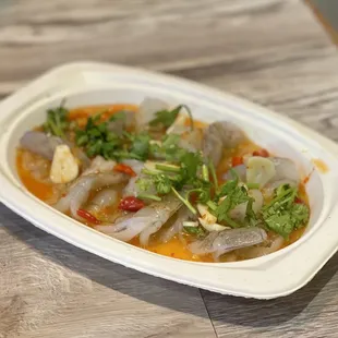a plate of food on a wooden table
