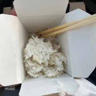 a box of rice and chopsticks