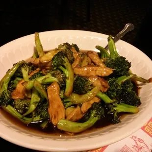 a plate of stir fried broccoli