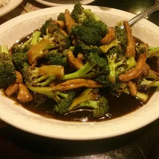 a plate of stir fried broccoli