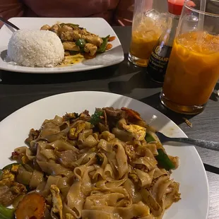Beef drunken noodles, basil chicken with rice. Thai iced teas.
