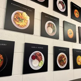 a wall of plates of food