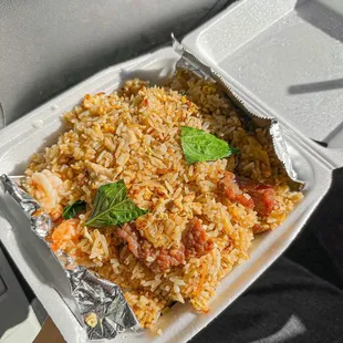 a tray of rice and vegetables