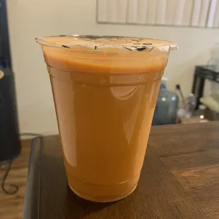 a cup of iced coffee on a table