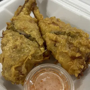 Chicken Angel Wings with sweet dipping sauce on the side.