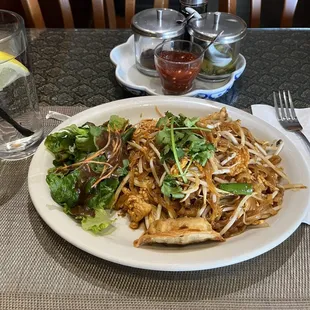 Lunch portion Pad Thai, includes a side salad.