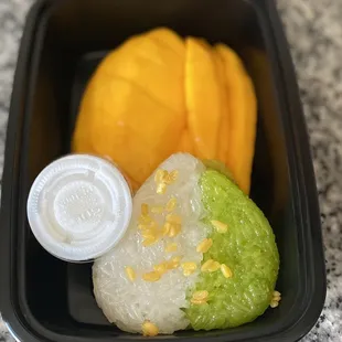 Sticky rice with mango and extra coconut sauce my first time trying this dish ever...GASM! So Delicious!!