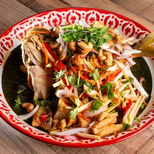 a bowl of stir fried fish