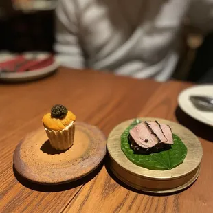 Uni and crab tart (left) and foie gras duck breast wrap (right)
