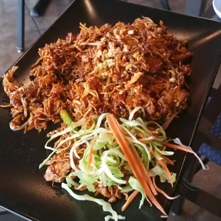 Crispy pork pad thai. Very very salty. I&apos;ve had their regular pad thai which is better.