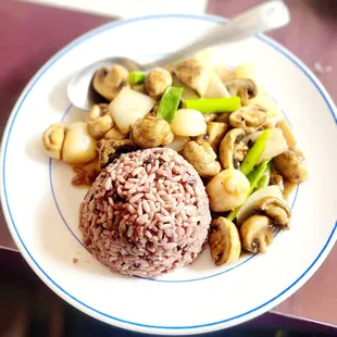 a plate of rice and vegetables