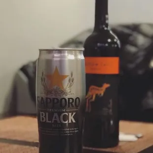 a beer and a bottle on a table