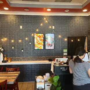 a woman standing at the counter