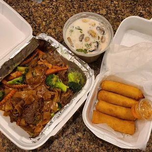 two takeout containers of food
