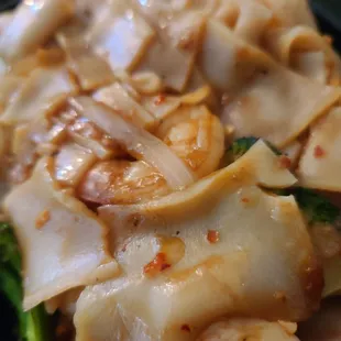 a plate of noodles and vegetables