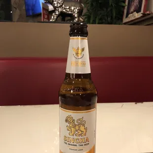 a bottle of beer on a table