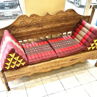 Thai style bench with cushions.