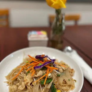 a plate of noodles and vegetables