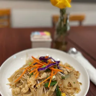 a plate of noodles and vegetables