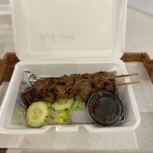 Pork Sticks (take-out) with spices served on side.