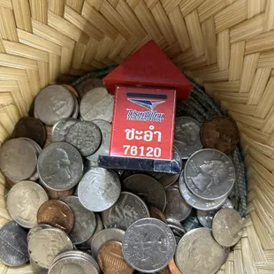 Change basket at register, with this little red thing in it. I have no idea why it's there, but it's interesting