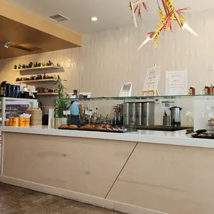 a woman standing in front of the counter