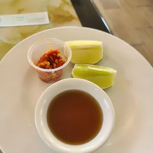 Add fresh red hot chili pepper  and fish sauce to taste