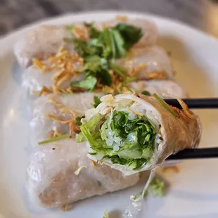 a plate of food with chopsticks