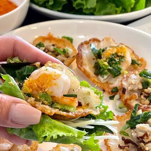 a hand holding a piece of food