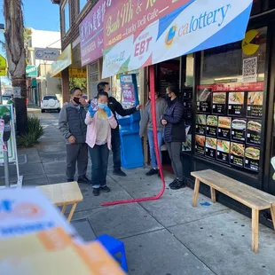 people standing outside of a store