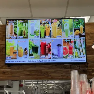 a large flat screen television mounted above a kitchen counter