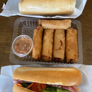 grilled pork banh mi, egg rolls, and the dac biet banh mi