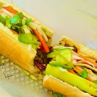 shaken beef banh mi with added egg