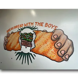 two hands holding a sandwich