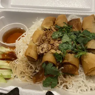 Vietnamese spring rolls over vermicelli