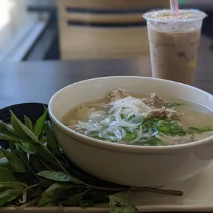 a bowl of soup and a drink