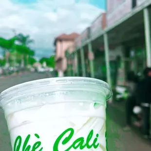 a hand holding a cup of coffee