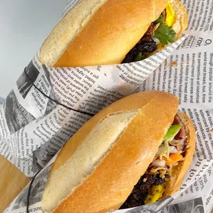 two sandwiches on a cutting board